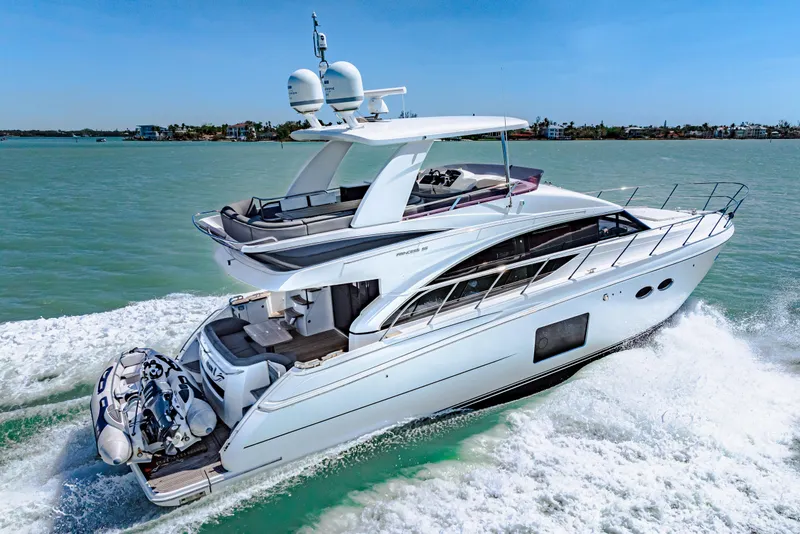 Slide: The Image of Luxurious 2017 Princess 56 yacht cruising on clear blue waters. - 20