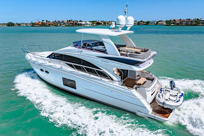 Slide: The Image of Luxurious 2017 Princess 56 yacht cruising on clear blue waters. - 24