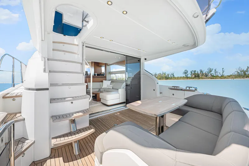 Slide: The Image of Luxurious 2017 Princess 56 yacht interior with elegant seating and scenic ocean view. - 36