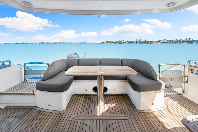 Slide: The Image of Luxury yacht deck with seating, Princess 56, 2017 model, overlooking serene blue waters. - 37