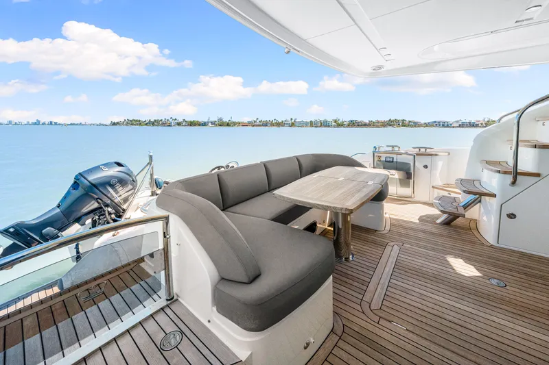 Slide: The Image of Luxurious 2017 Princess 56 yacht deck with seating, table, and ocean view. - 38