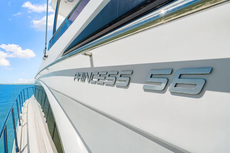 Slide: The Image of Side view of a 2017 Princess 56 yacht with clear blue sky and ocean. - 41