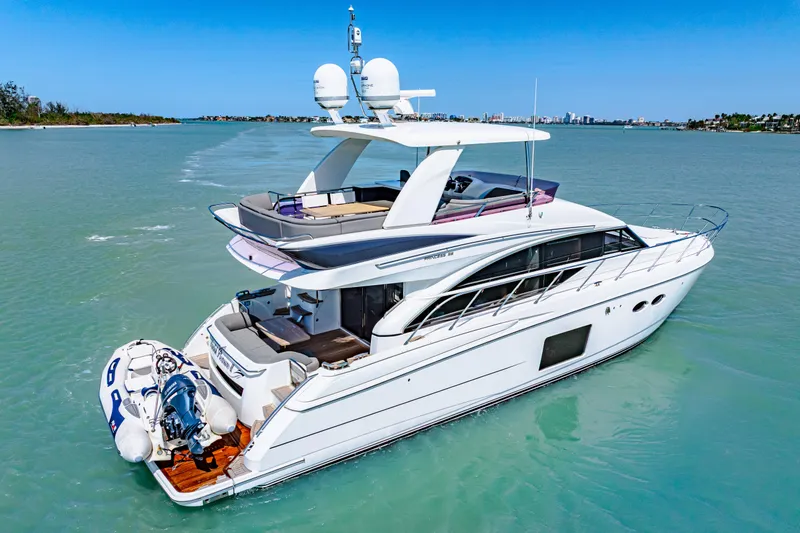 Slide: The Image of Luxurious 2017 Princess 56 yacht cruising on clear blue waters. - 5