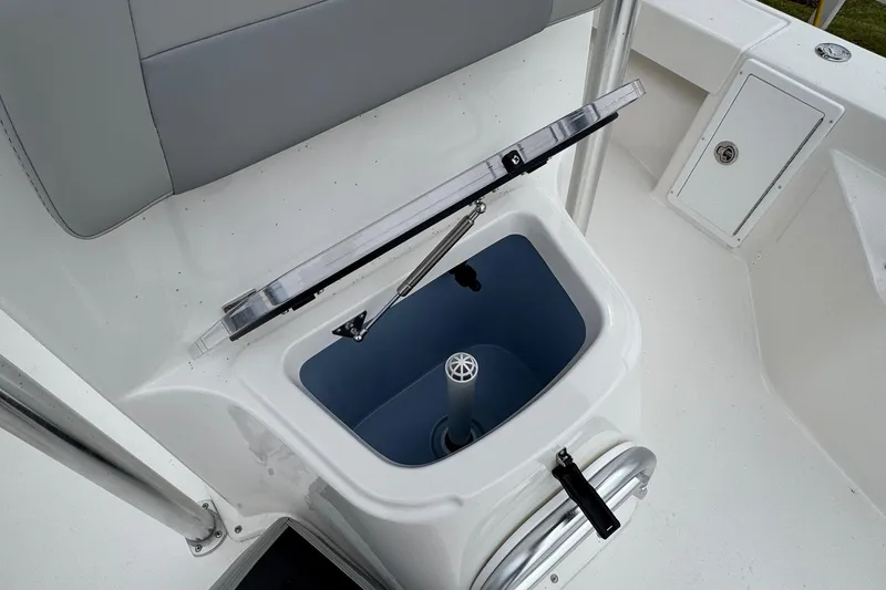 Slide: The Image of 2026 Bay Rider 239 boat interior with open storage compartment and seating. - 12
