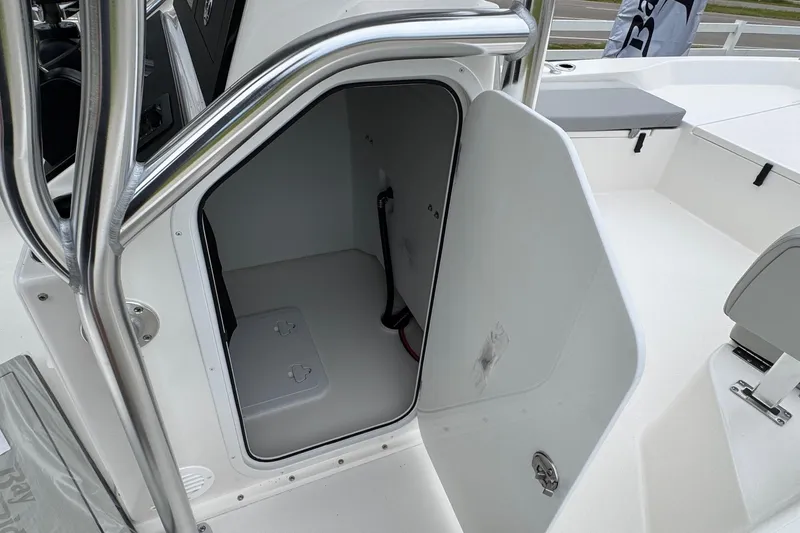 Slide: The Image of Open storage compartment on 2026 Bay Rider 239 boat, showcasing interior space and design. - 7