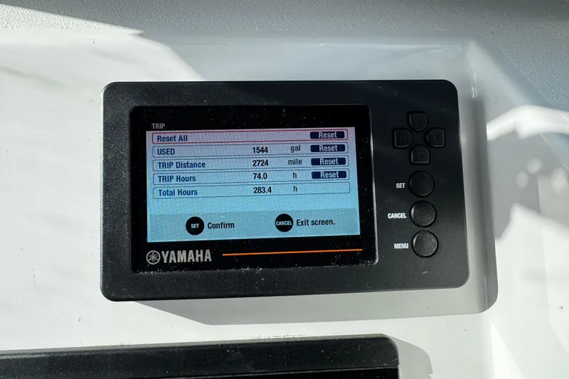 Slide: The Image of Yamaha display on 2021 Parker 2320 Sport Cabin showing trip data and fuel usage. - 18