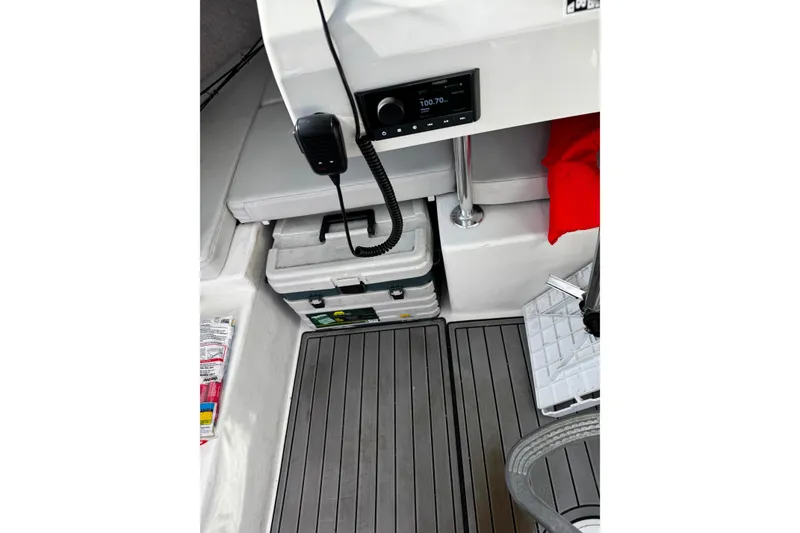 Slide: The Image of Interior of 2021 Parker 2320 Sport Cabin with radio, storage, and seating. - 19