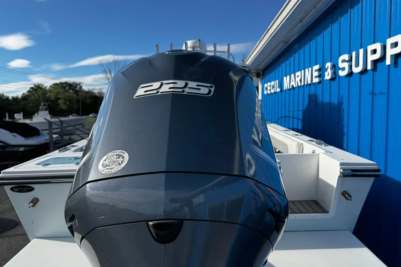 Slide: The Image of 2021 Parker 2320 Sport Cabin boat with 225 engine at marine supply store. - 32