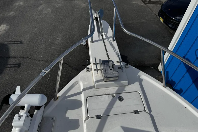 Slide: The Image of Bow view of 2021 Parker 2320 Sport Cabin boat with anchor and railing. - 6