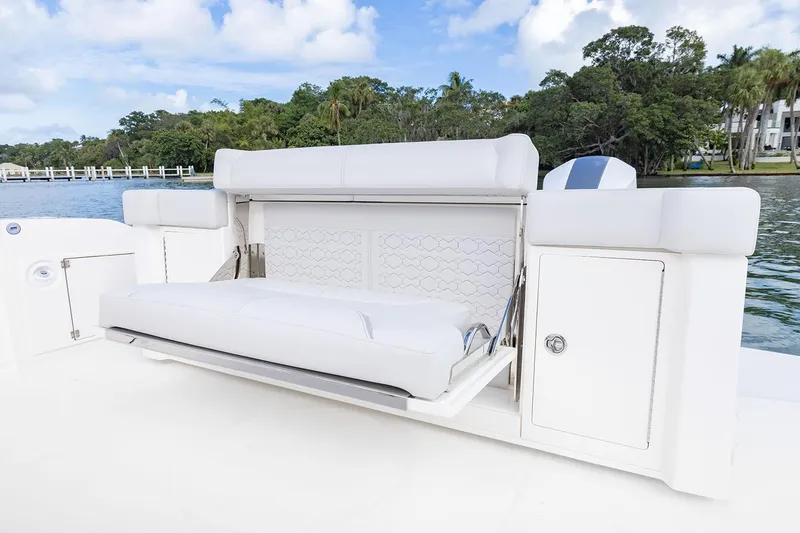Slide: The Image of Manufacturer Provided Image: 2025 Tiara Yachts 43 LS luxury seating area with scenic waterway backdrop. - 22
