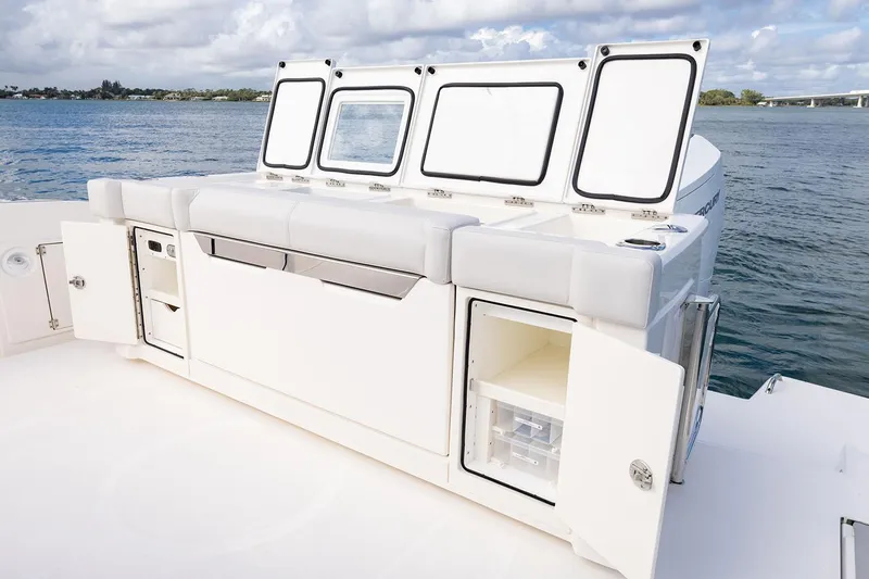 Slide: The Image of Manufacturer Provided Image: 2025 Tiara Yachts 43 LS boat interior with storage compartments and seating, on calm water. - 23