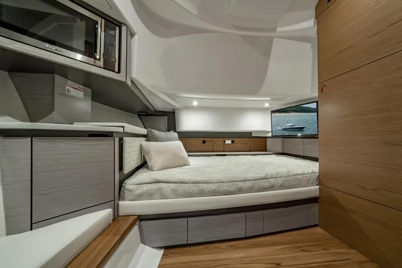 Slide: The Image of Manufacturer Provided Image: Luxurious interior of 2025 Tiara Yachts 43 LS, featuring a cozy bed and modern design. - 26