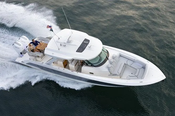 Slide: The Image of Manufacturer Provided Image: 2025 Tiara Yachts 43 LS cruising on water, aerial view. - 5