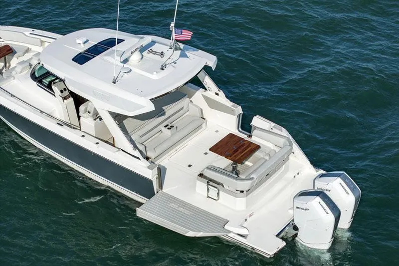 Slide: The Image of Manufacturer Provided Image: 2025 Tiara Yachts 43 LS luxury boat on water, featuring spacious deck and modern design. - 6