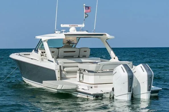 Slide: The Image of Manufacturer Provided Image: 2025 Tiara Yachts 43 LS luxury boat on open water, rear view. - 7