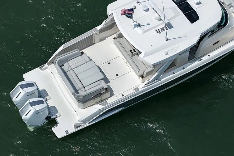 Slide: The Image of Manufacturer Provided Image: 2025 Tiara Yachts 43 LS luxury boat with dual engines on open water. - 8