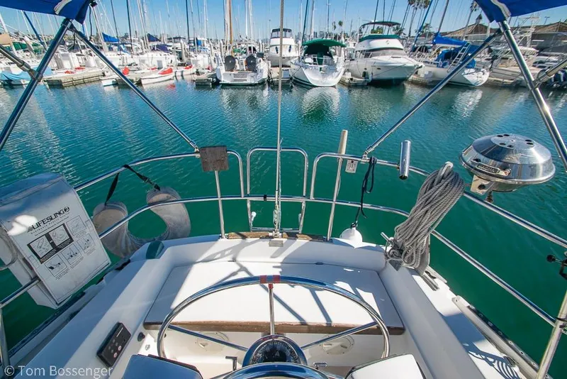 Slide: The Image of Cockpit view of 1984 Catalina 36 sailboat docked in a marina. - 26