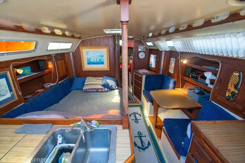 Slide: The Image of Interior of a 1984 Catalina 36 sailboat with cozy seating and nautical decor. - 5