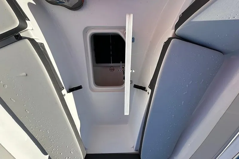 Slide: The Image of 2026 Sea Pro 202 Center Console boat interior with open storage compartment. - 21