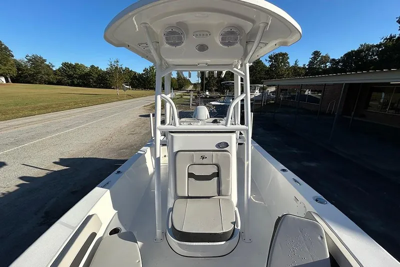 Slide: The Image of 2026 Sea Pro 202 Center Console boat, white interior, parked on a sunny day. - 25