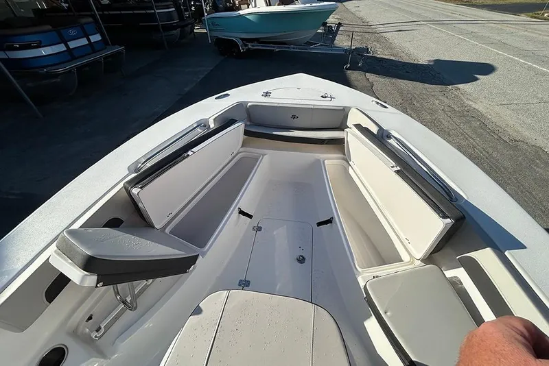 Slide: The Image of 2026 Sea Pro 202 Center Console boat interior with seating and storage compartments. - 26