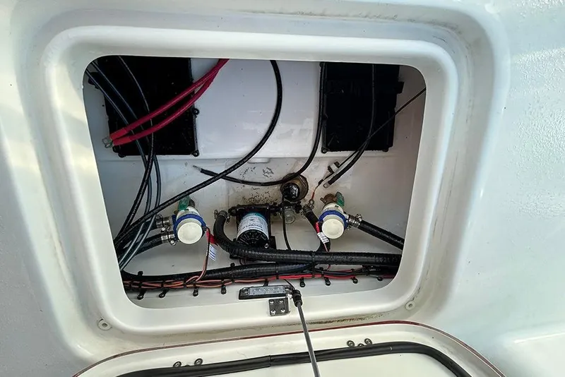 Slide: The Image of 2026 Sea Pro 202 Center Console boat wiring and plumbing compartment. - 31