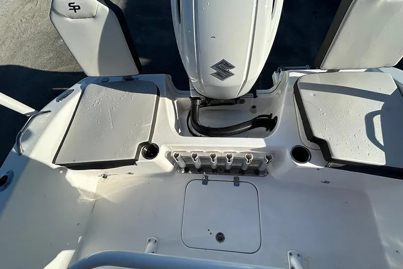 Slide: The Image of 2026 Sea Pro 202 Center Console boat interior with Suzuki engine and seating. - 32