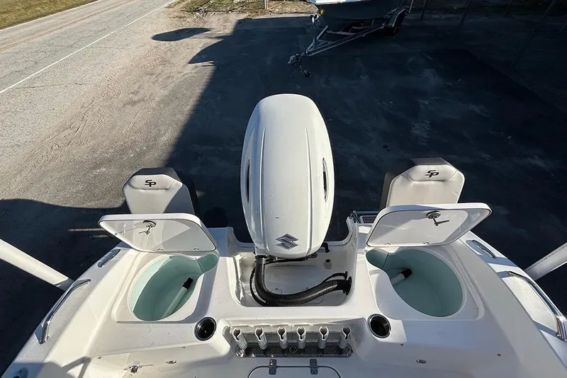 Slide: The Image of 2026 Sea Pro 202 Center Console boat with open storage compartments and outboard motor. - 34