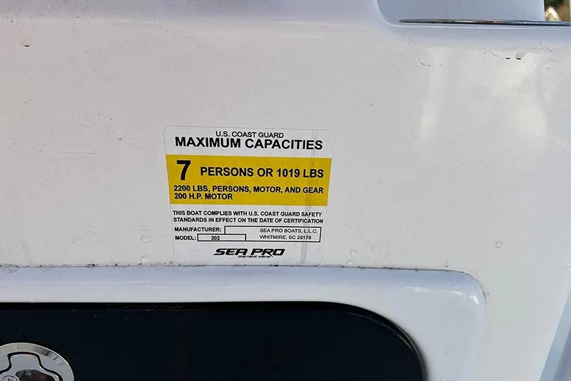 Slide: The Image of 2026 Sea Pro 202 Center Console capacity label, 7 persons or 1019 lbs, 200 HP motor. - 40