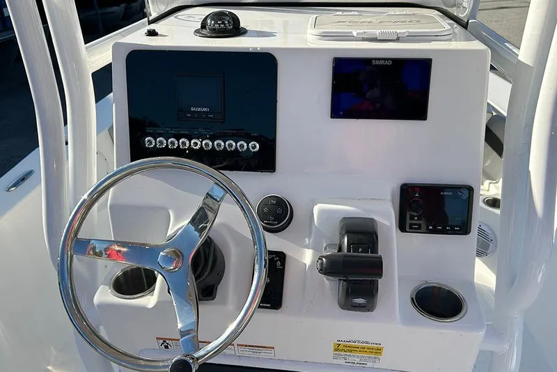 Slide: The Image of 2026 Sea Pro 202 Center Console dashboard with steering wheel and electronic controls. - 41