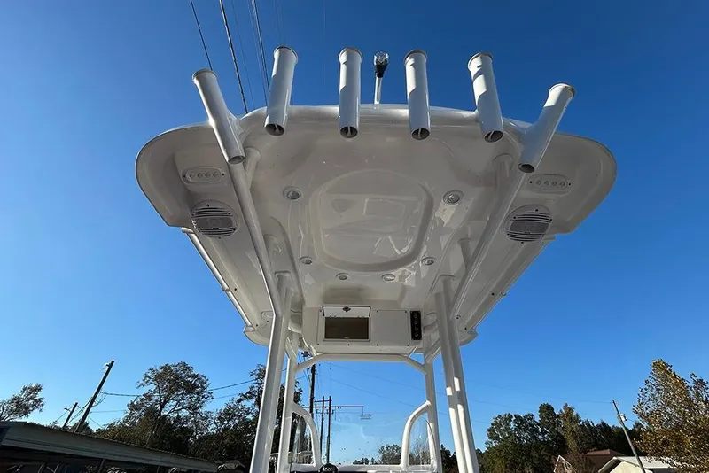 Slide: The Image of 2026 Sea Pro 202 Center Console boat with rod holders and speakers, viewed from below. - 53