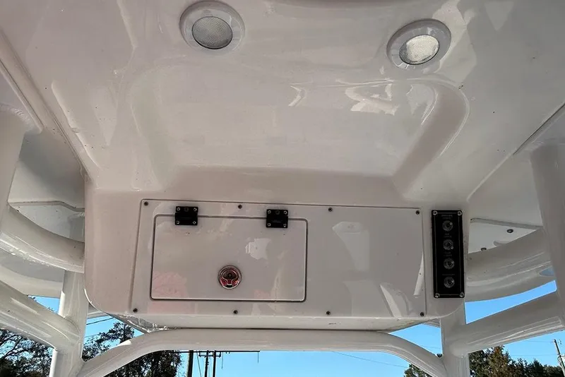 Slide: The Image of 2026 Sea Pro 202 Center Console boat interior ceiling with lights and control panel. - 55