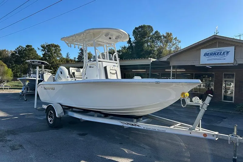 Slide: The Image of 2026 Sea Pro 202 Center Console boat on trailer at Berkeley Outdoors dealership. - 8
