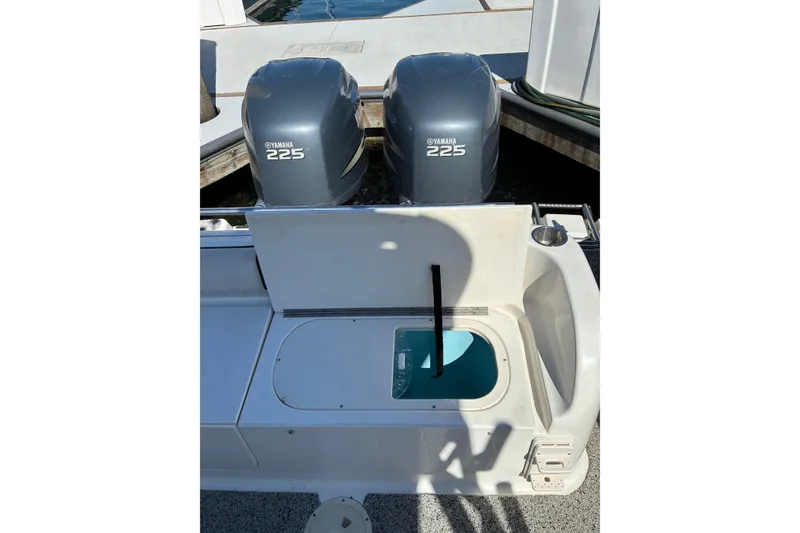 Slide: The Image of 2007 Robalo R265 Walkaround boat with twin Yamaha 225 engines, docked. - 5