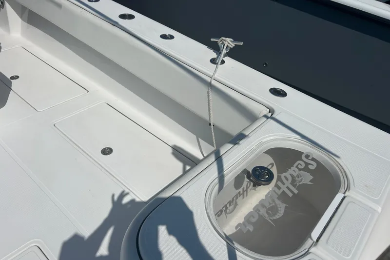Slide: The Image of 2016 SeaHunter 39 Tournament boat deck with storage compartments and rope. - 12
