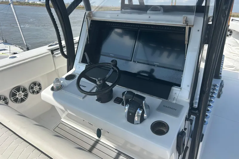 Slide: The Image of 2016 SeaHunter 39 Tournament boat helm with Garmin displays and steering wheel. - 16
