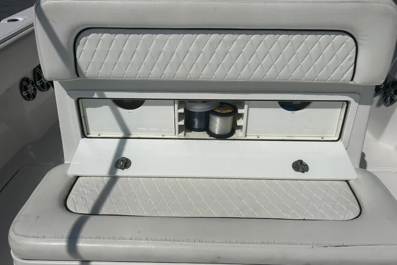 Slide: The Image of 2016 SeaHunter 39 Tournament boat storage compartment with fishing line spools. - 17