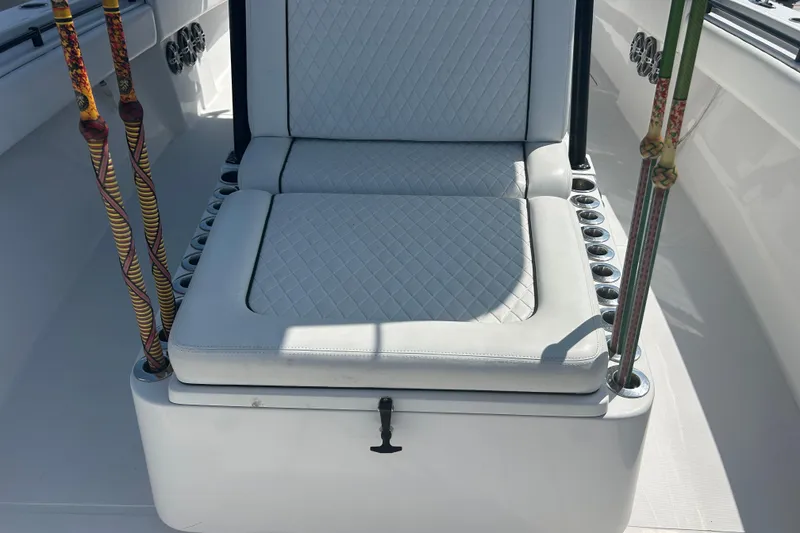 Slide: The Image of 2016 SeaHunter 39 Tournament boat seat with rod holders and quilted upholstery. - 25