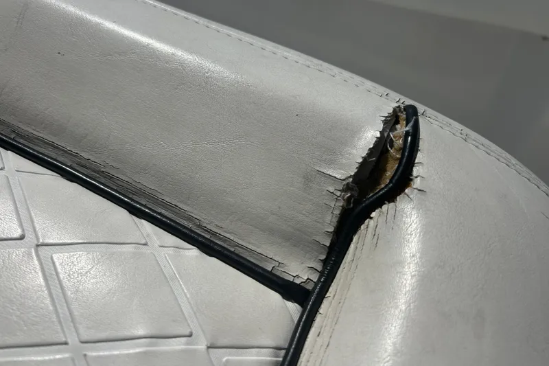 Slide: The Image of Torn upholstery on 2016 SeaHunter 39 Tournament boat seat, showing wear and damage. - 31