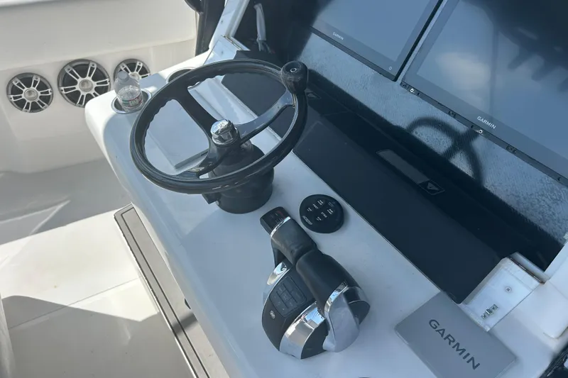 Slide: The Image of Helm of 2016 SeaHunter 39 Tournament with Garmin displays and controls. - 32