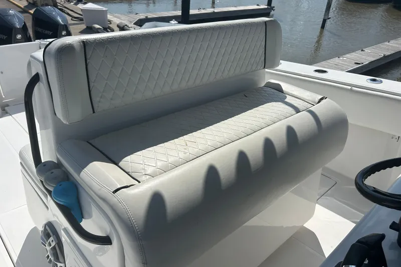 Slide: The Image of 2016 SeaHunter 39 Tournament boat with cushioned seating and diamond-pattern upholstery. - 33