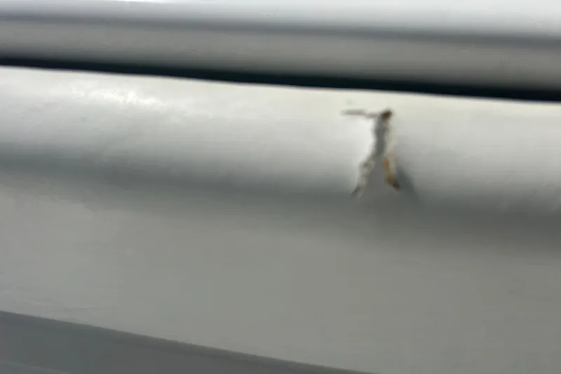 Slide: The Image of Close-up of a scratch on a 2016 SeaHunter 39 Tournament boat surface. - 36