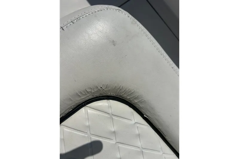 Slide: The Image of Close-up of worn upholstery on 2016 SeaHunter 39 Tournament boat seat. - 46