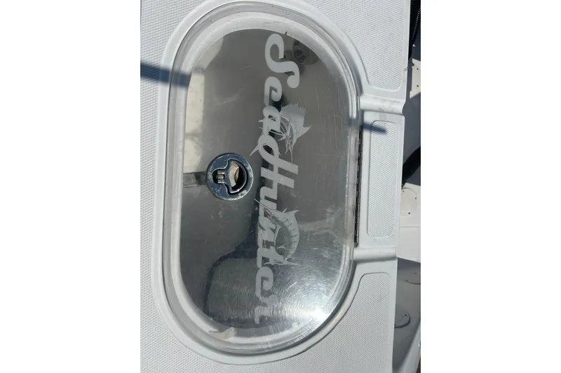 Slide: The Image of 2016 SeaHunter 39 Tournament boat compartment with logo on transparent cover. - 48