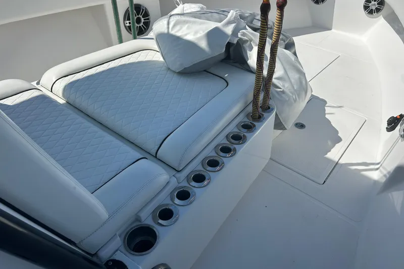 Slide: The Image of 2016 SeaHunter 39 Tournament boat interior with white cushioned seating and rod holders. - 51