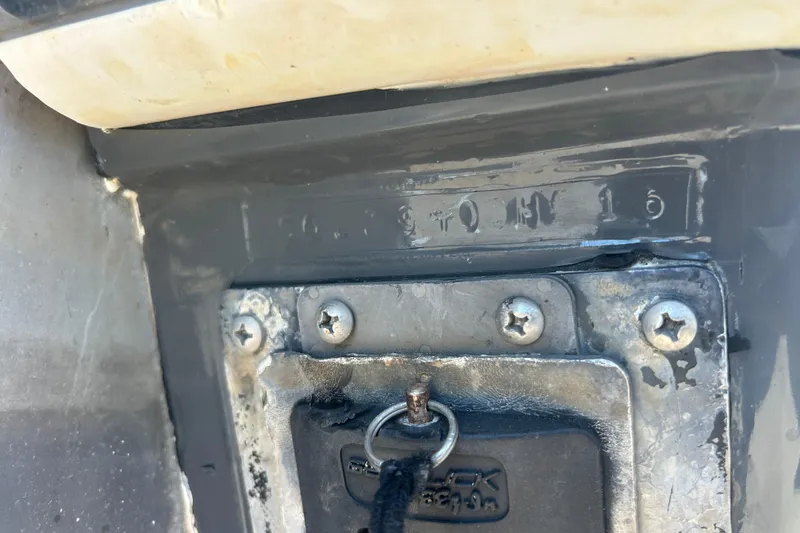Slide: The Image of Close-up of a 2016 SeaHunter 39 Tournament boat's identification plate with visible screws. - 52