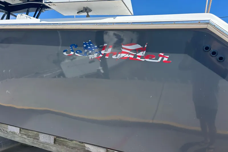 Slide: The Image of 2016 SeaHunter 39 Tournament boat with American flag-themed logo on the side. - 6
