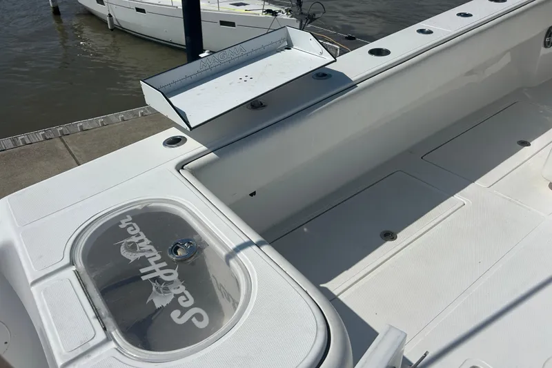 Slide: The Image of 2016 SeaHunter 39 Tournament boat deck with fishing rod holders and storage compartments. - 9