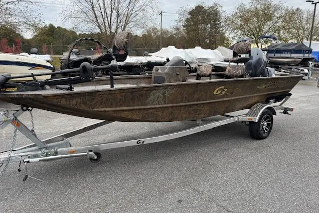 The Image of 2023 G3 Gator Tough 17 SC boat on trailer, parked outdoors. - 1