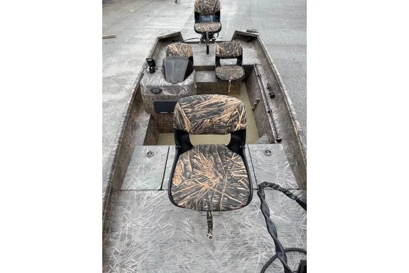 Slide: The Image of 2023 G3 Gator Tough 17 SC boat interior with camo seats and steering console. - 6